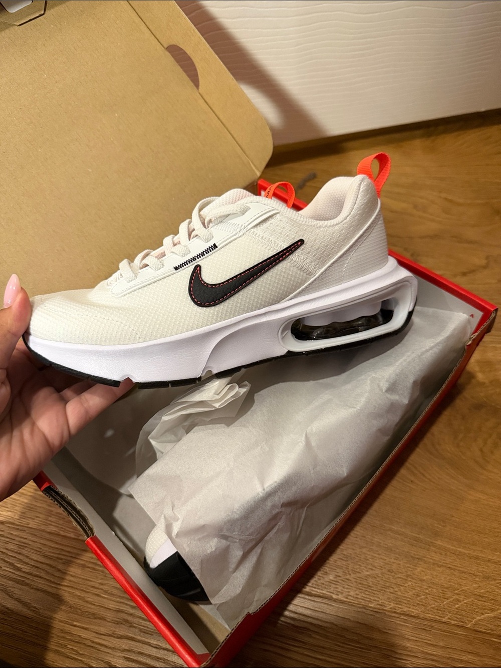 Nike Men’s White Sneakers with Black Swoosh and Orange Pull Tab